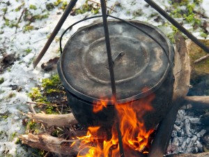 Cooking soup in a winter forest